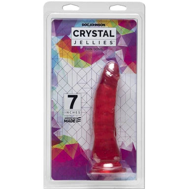 a pink penis shaped dildo with a suction cup base shown inside its plastic packaging