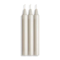 three white candles with white wicks