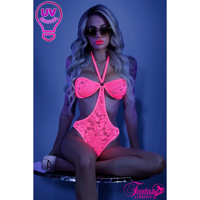 blonde female sitting on table with uv pink lace teddy front view