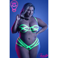 female standing with strappy uv bra & panty set front view