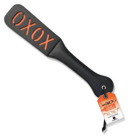a black paddle with the orange word oxox on the end
