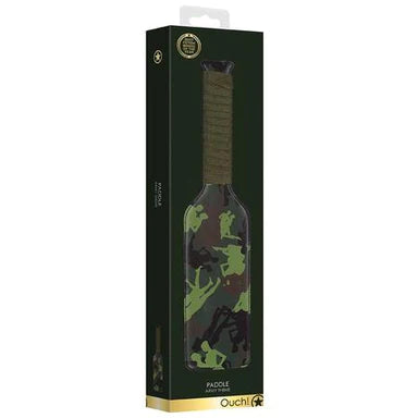 a dark green box depicting a green paddle that has a pattern of couples on it