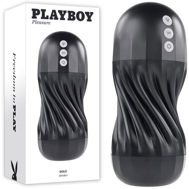 Image shows the white playboy packaging with the back hard shelled masturbator beside it. The masturbator has a hard black shell with a twisted core design and three silver buttons on it 