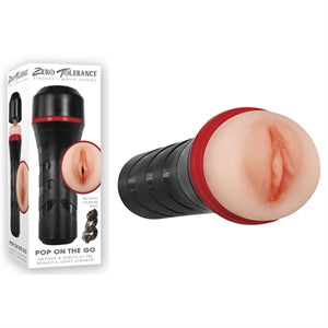 White packaging next to the beige male masturbator. The masturbator has a vaginal opening, a hard black shell and a twistable cap 