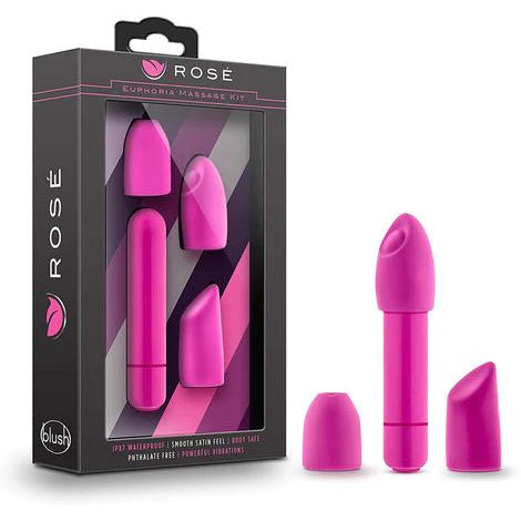 a pink sleek vibrator with a pink tip that has a circular button near the tip, there is also a sloped tip and a flat head tip that is interchangeable, shown next to its purple display box