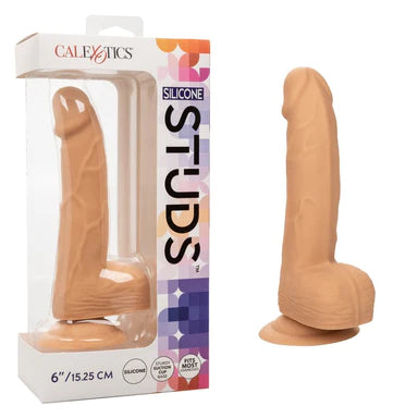 a beige detailed penis shaped dildo with balls and a suction cup, shown next to its display box