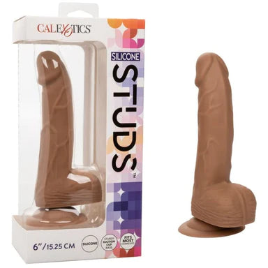 a brown detailed penis shaped dildo with balls and a suction cup, shown next to its display box