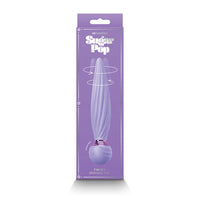 a purple display box depicting a purple vibrator with a tapered shaft, twisted vertical ridges along the shaft and a gold ring at the bulb handle