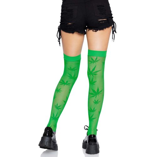 Green leaf-patterned thigh-high stockings worn with black shorts and black shoes on a white background