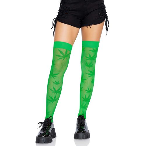 Green leaf-patterned thigh-high socks worn with black shorts and black shoes on a white background