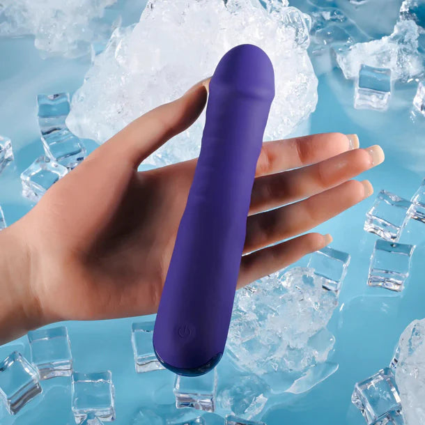 Purple handheld vibrator held in a hand with ice cubes in the background