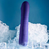 Purple silicone vibrator with 'SELOPA' branding on ice cubes against a blue background
