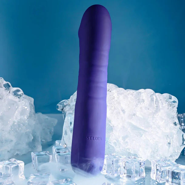 Purple silicone vibrator with 'SELOPA' branding on ice cubes against a blue background