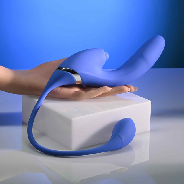 Blue all in one vibrator with vibrating tail against hand example photo.