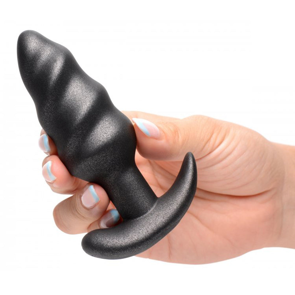 Black swirl anal plug example photo.
