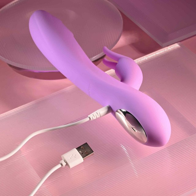Pink vibrator example photo with charging cord.