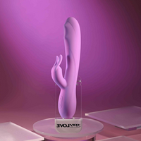 Pink bead the way vibrator against display case example photo.