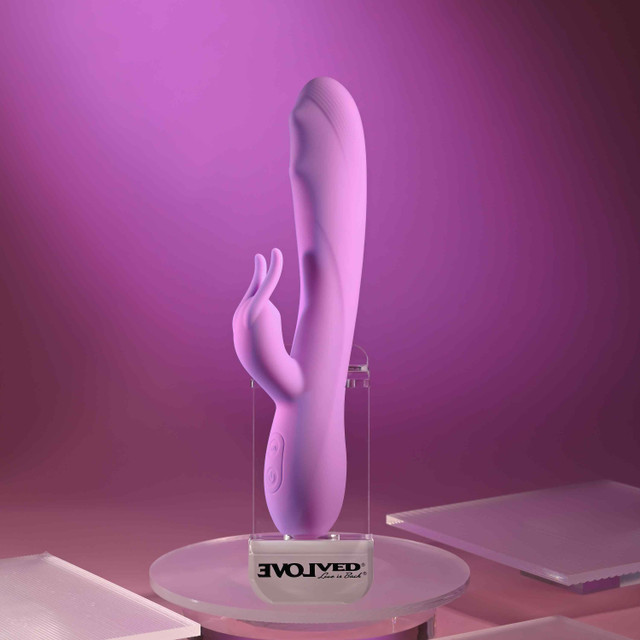 Pink bead the way vibrator against display case example photo.