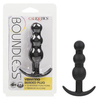 black vibrating anal plug with 3 balls on body for different widths, beside plastic packaging