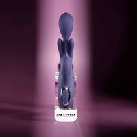 Purple bow down vibrator against display case example photo.