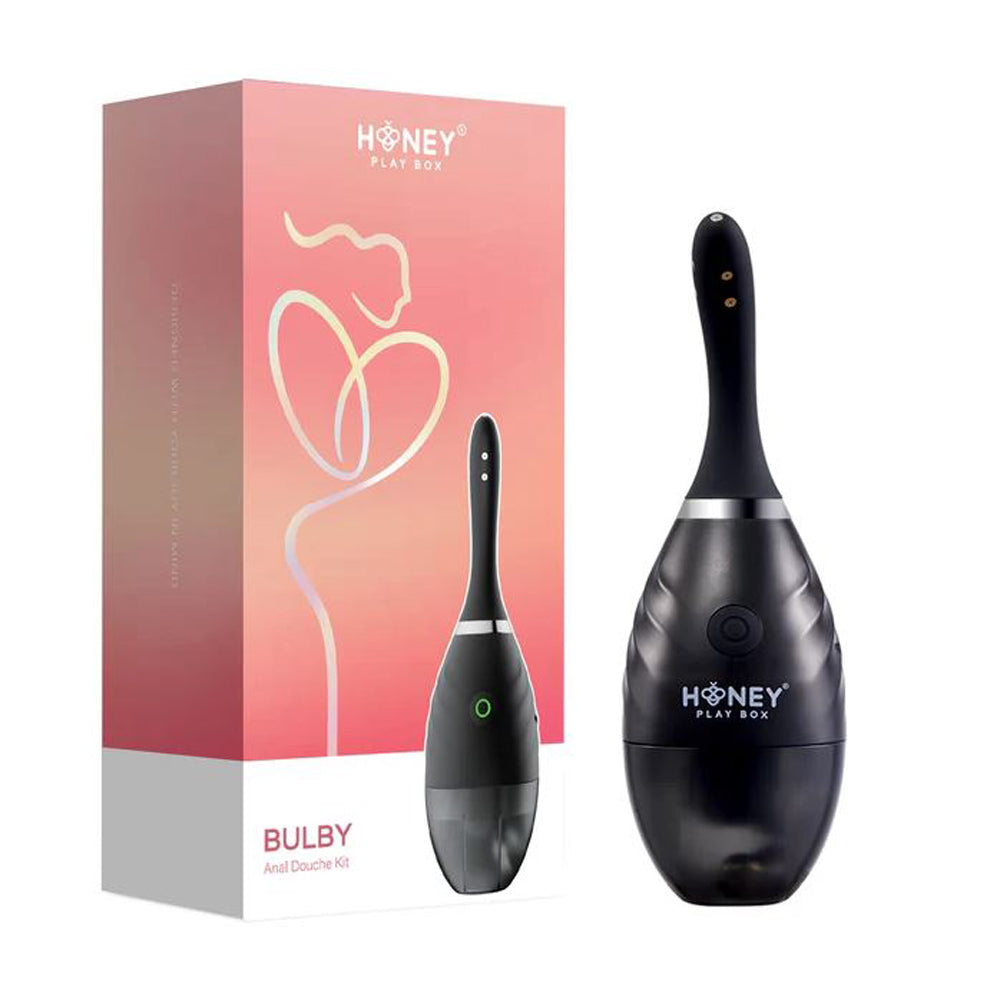 Black anal douche kit beside box