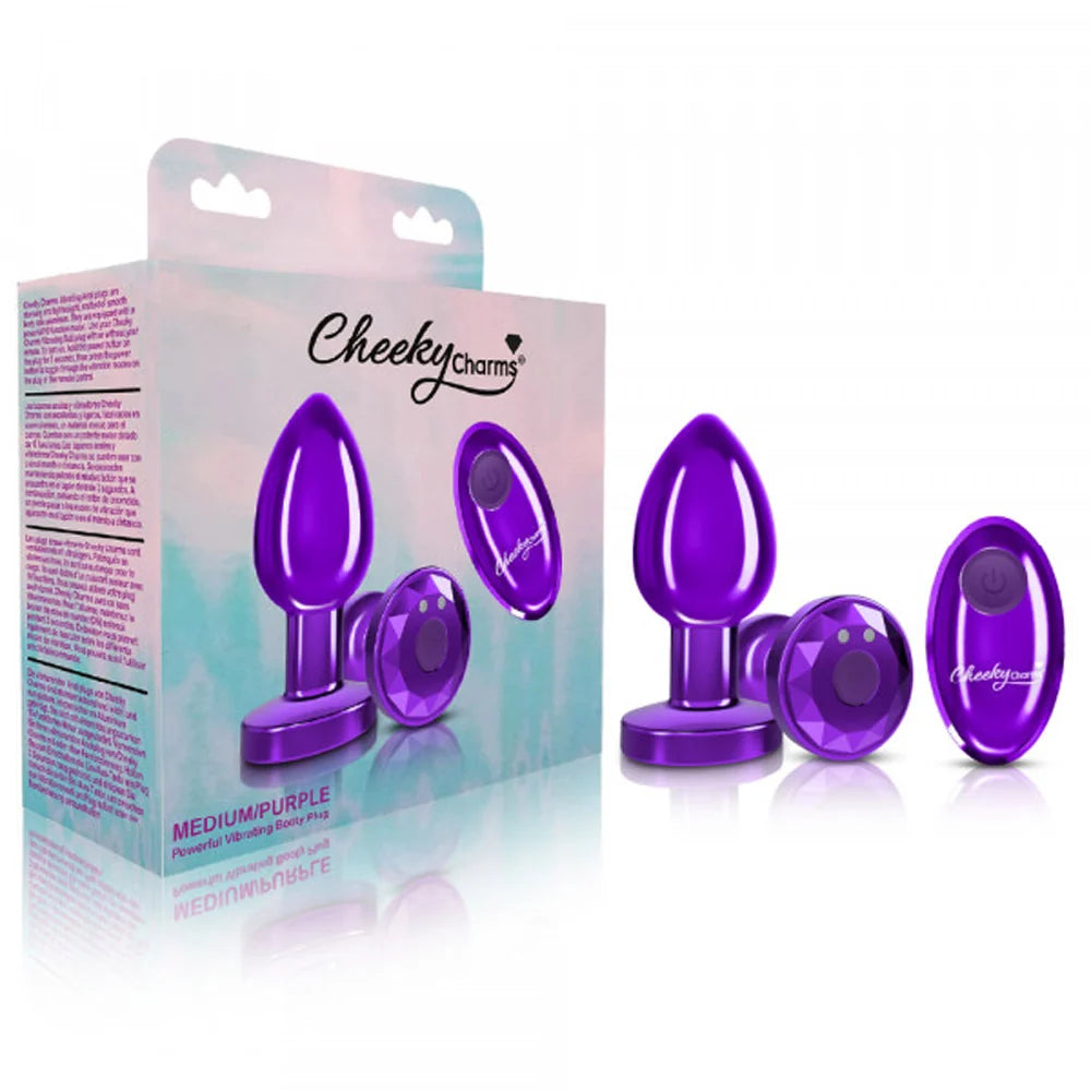 Purple cheeky charms vibrating anal plug beside packaging.