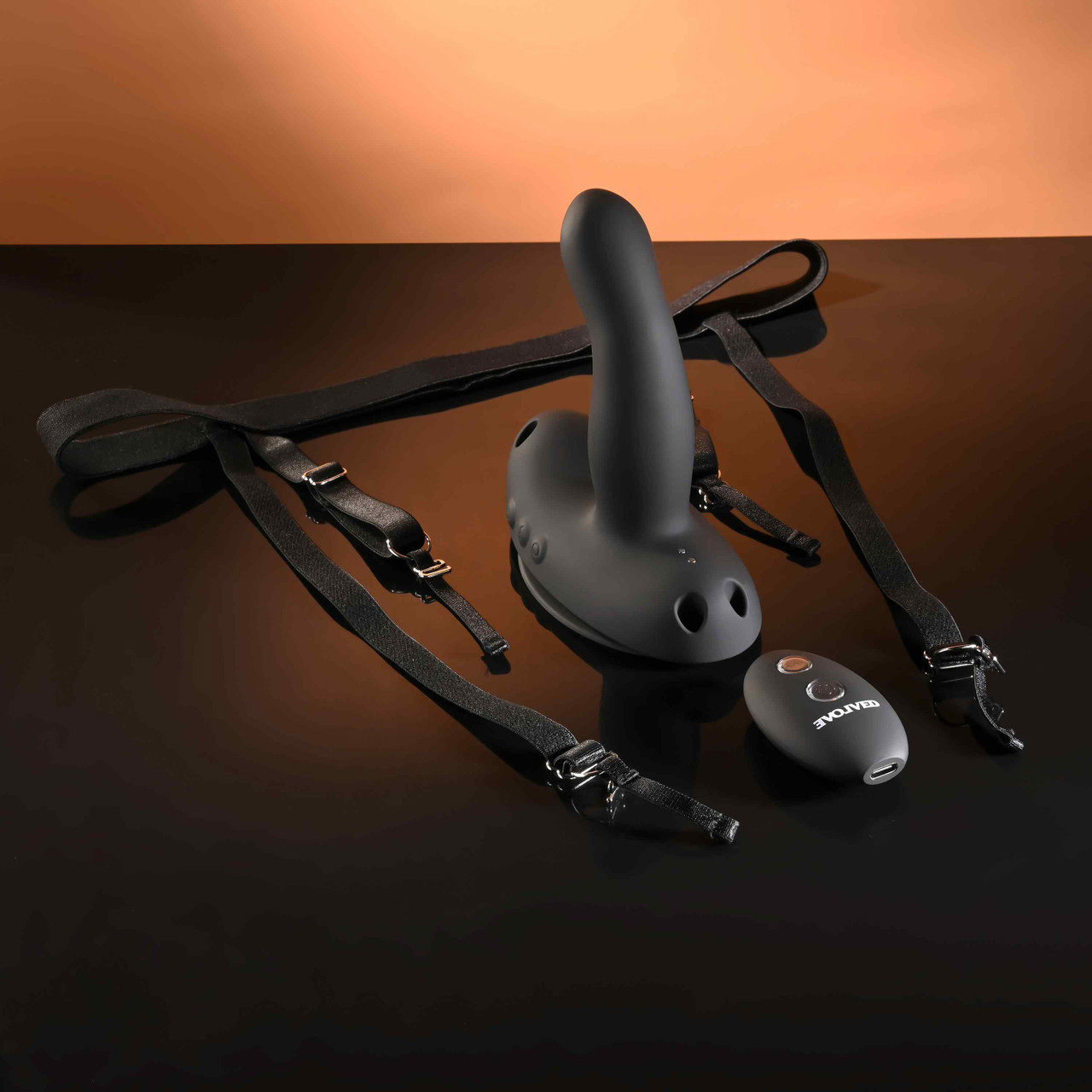 Black strap on harness wearable grinding vibrator with come hither motion & 32ft remote example photo.