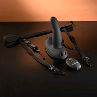 Black strap on harness wearable grinding vibrator with come hither motion & 32ft remote example photo.
