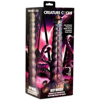 Multi colored deep invader dildo with eggs inside packaging.