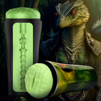 Glowing green cylindrical object with a creature in the background