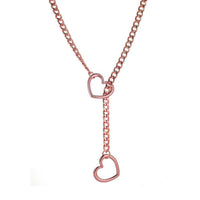 Rose gold necklace with heart-shaped pendants on a white background