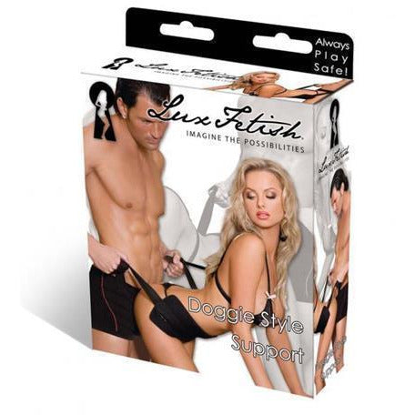 Product box with man supporting woman in doggie style position with black support strap