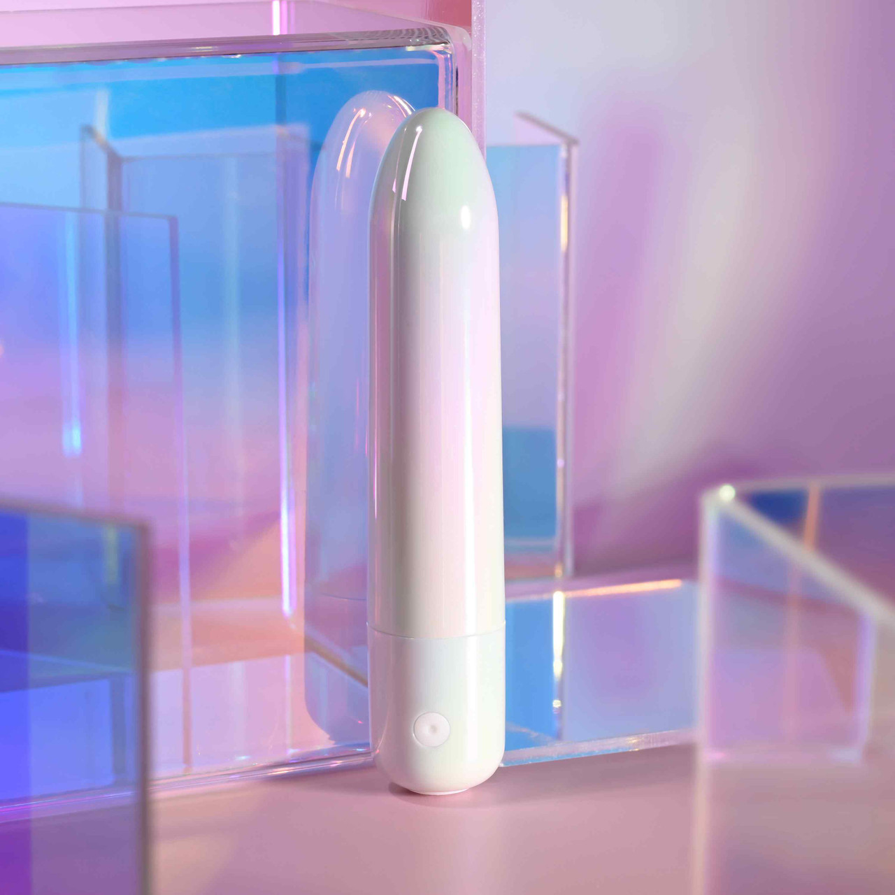 White bullet vibrator against display case example photo.