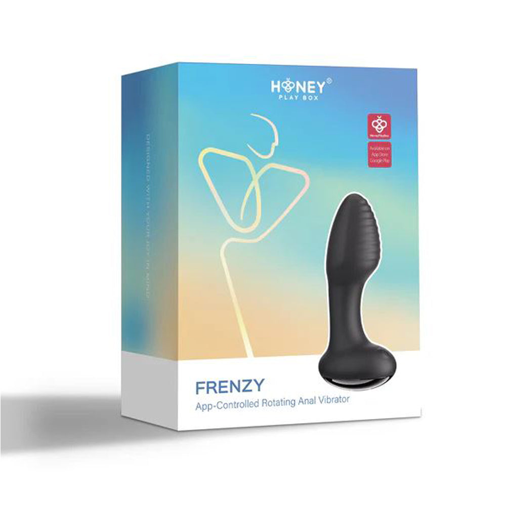 Black anal vibrator beside box
