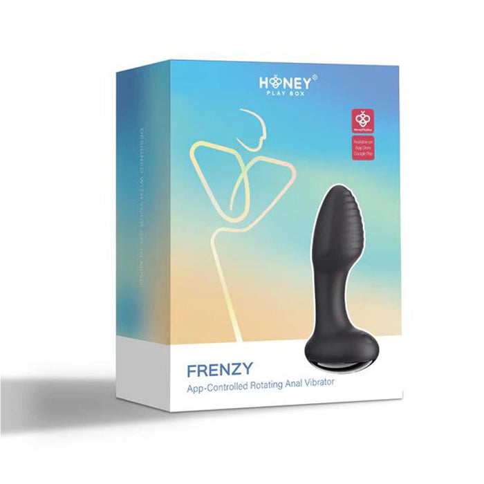 Black anal vibrator beside box