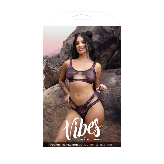 Pink cut out bralette & panty set inside packaging.