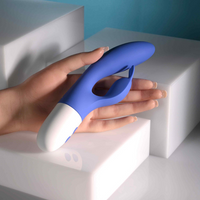 Blue funny bunny vibrator against hand photo.