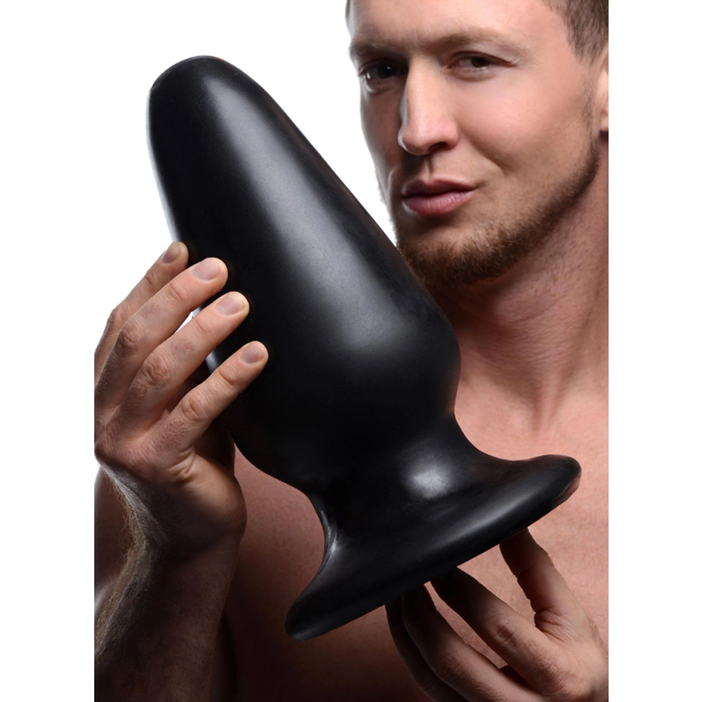 Black XXXL tapered butt plug example photo.