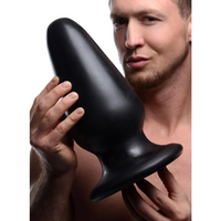 Black XXXL tapered butt plug example photo.