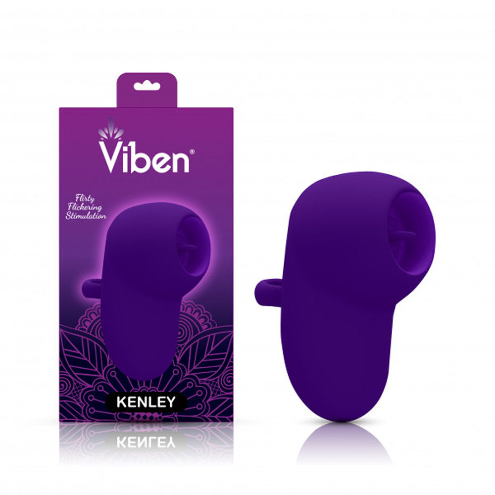 Purple flickering finger vibrator beside packaging.