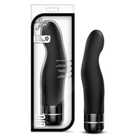 Black silicone vibrator with packaging on a white background
