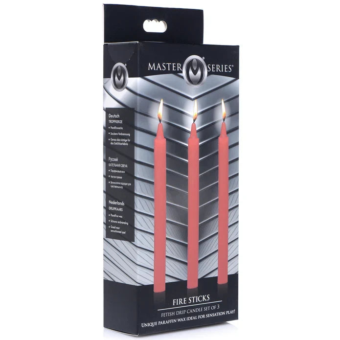 Red 3pk fire stick drip candles inside packaging.