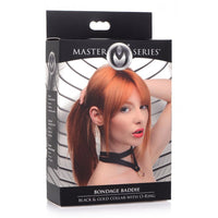 Black & gold bondage baddie collar with o-ring inside packaging.