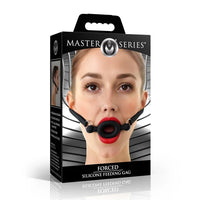 Black silicone feeding gag inside packaging.
