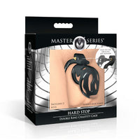 Black hard stop double ring chastity cage with keys inside packaging.