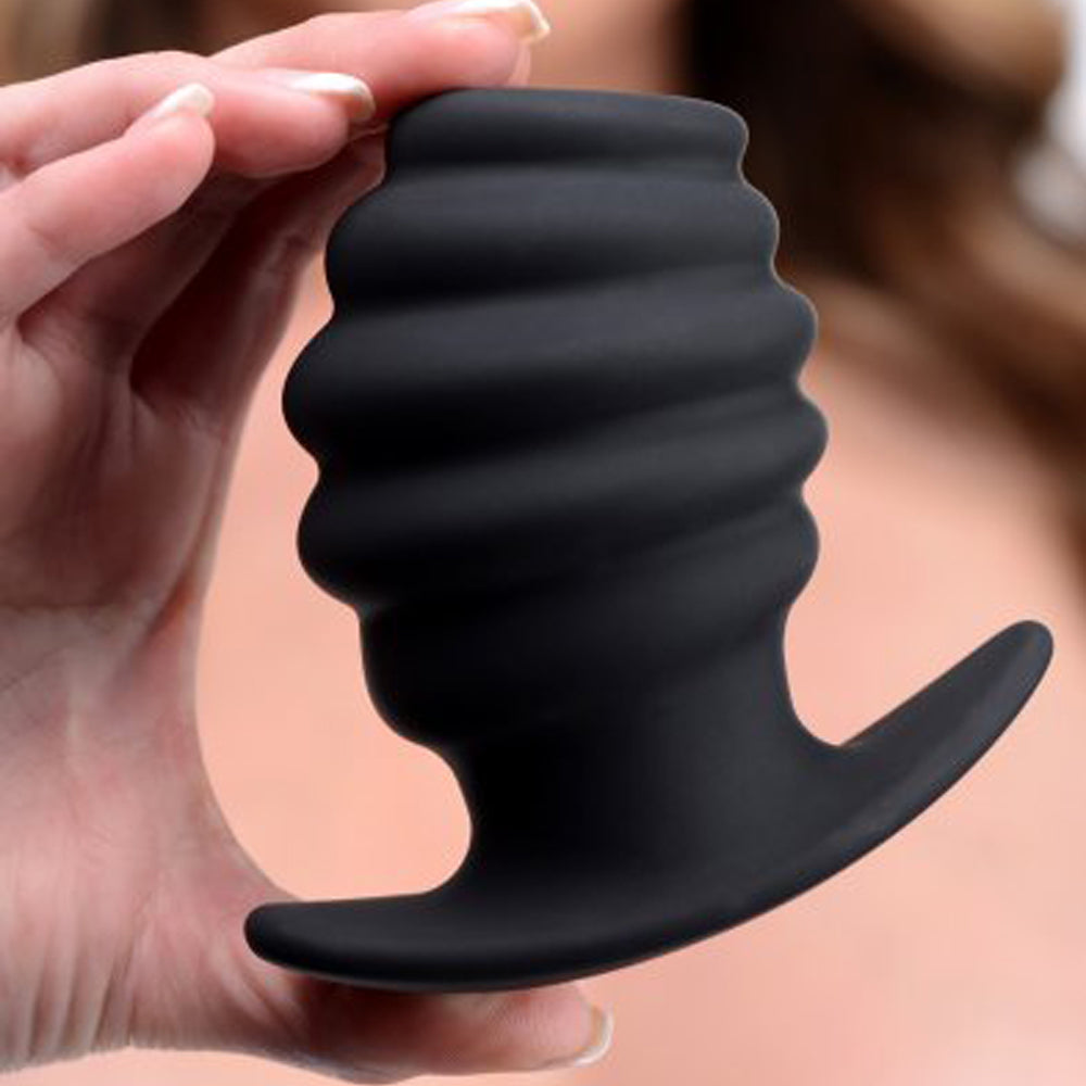 Black ribbed hollow anal plug example photo.