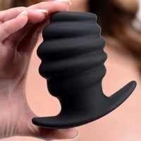 Black ribbed hollow anal plug example photo.