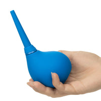 Cal Exotics One-Way Silicone Anal Douche in blue with flexible nozzle, shown held in hand