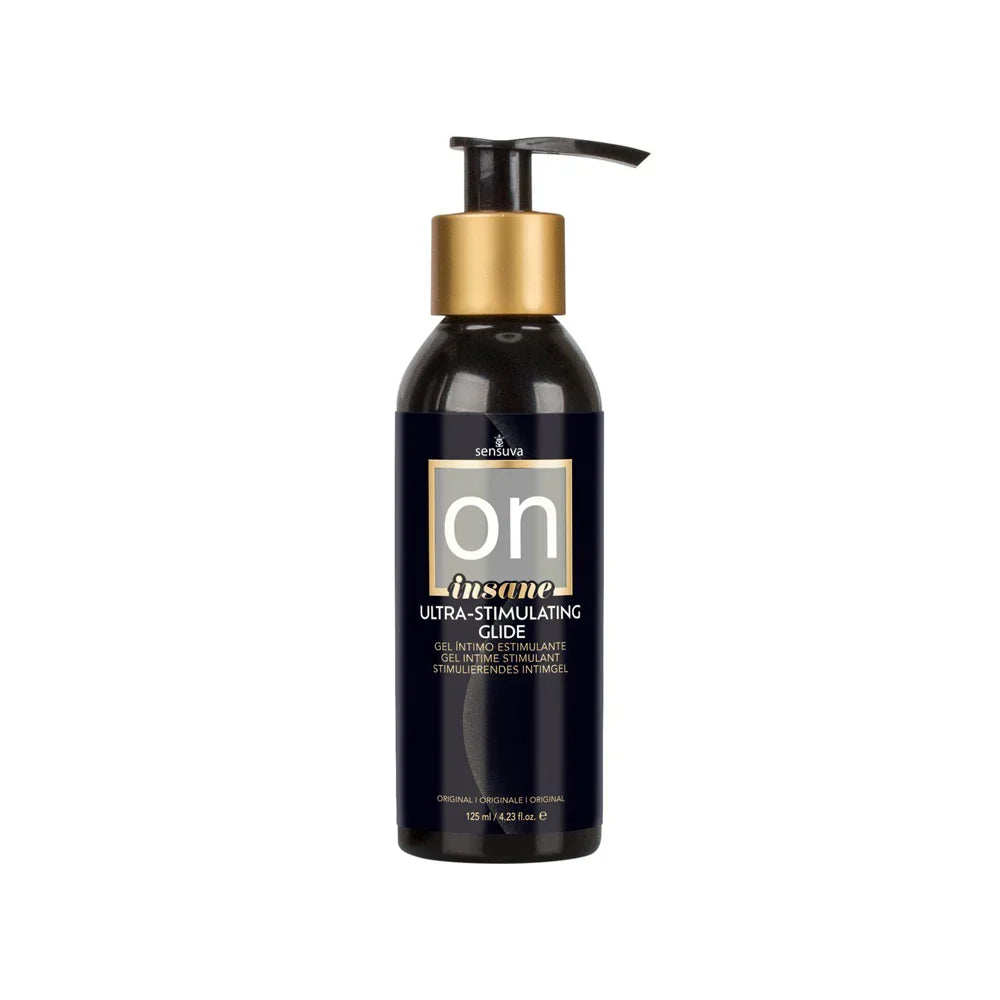 Black bottle with gold pump labeled 'on' insane ultra-stimulating-glide on a white background