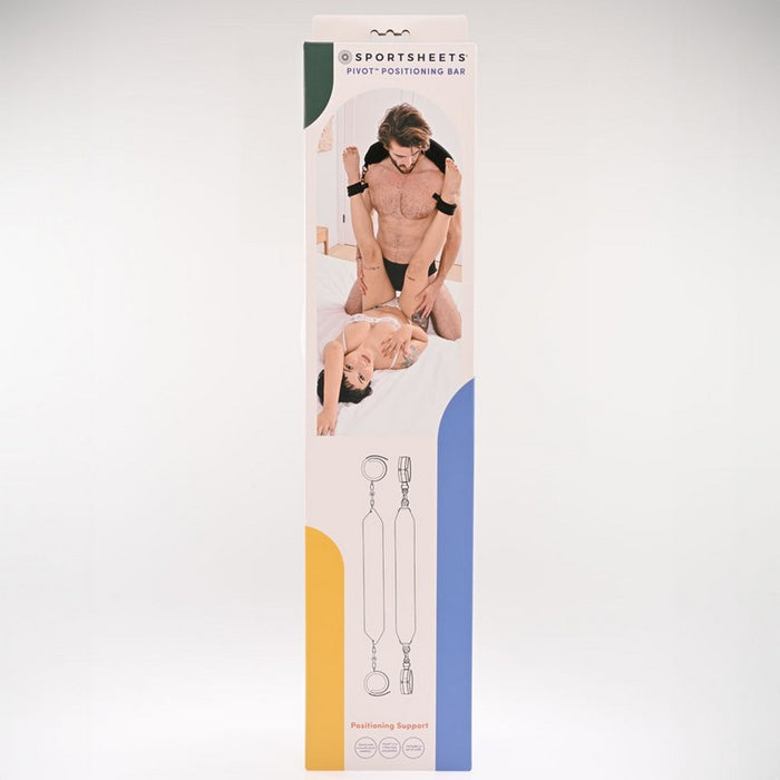 Product box with a man and a woman on the cover. The woman is on her back with her feet on the mans shoulders. The woman's feet are connected with black cuffs which are connected to a black strap which is wrapped around the man's back